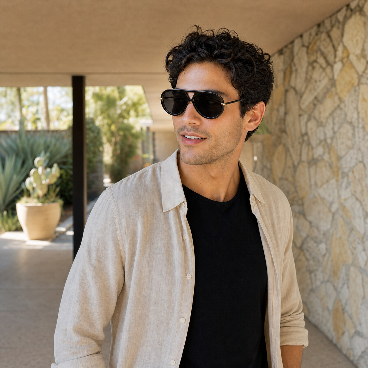 Young fashion model wearing NOCT Altitude oversized full-rim teardrop navigator with triangular double bridge sunglasses in Black / Smoke